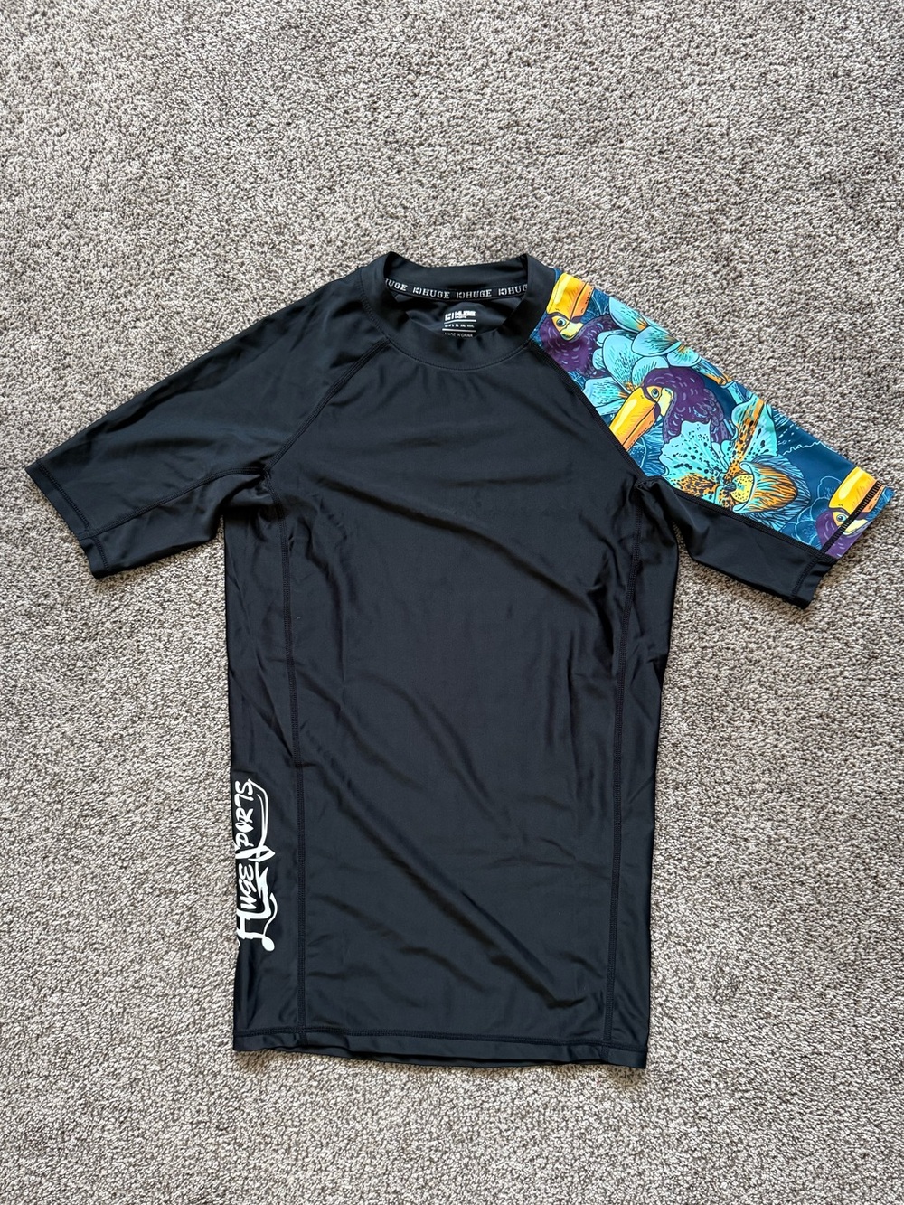 Huge Sports Men's Black Short Sleeve Swim Shirt With Blue Tropical Sleeve